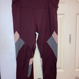 Maroon leggings with grey and pink strips by the knee/lower thigh!